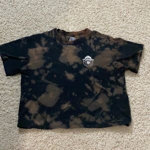 A bleach tie dye Smokey the bear t-shirt